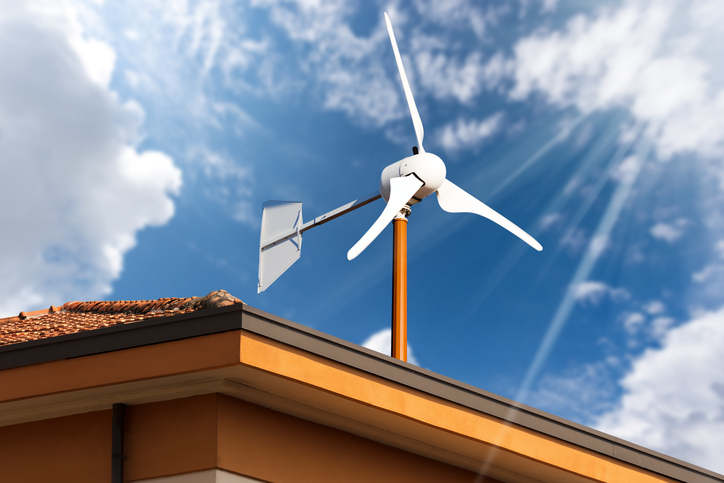 Small Wind Turbine on the top of a Roof of a House